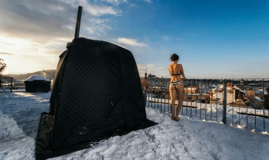 Tent sauna on a snowy rooftop terrace