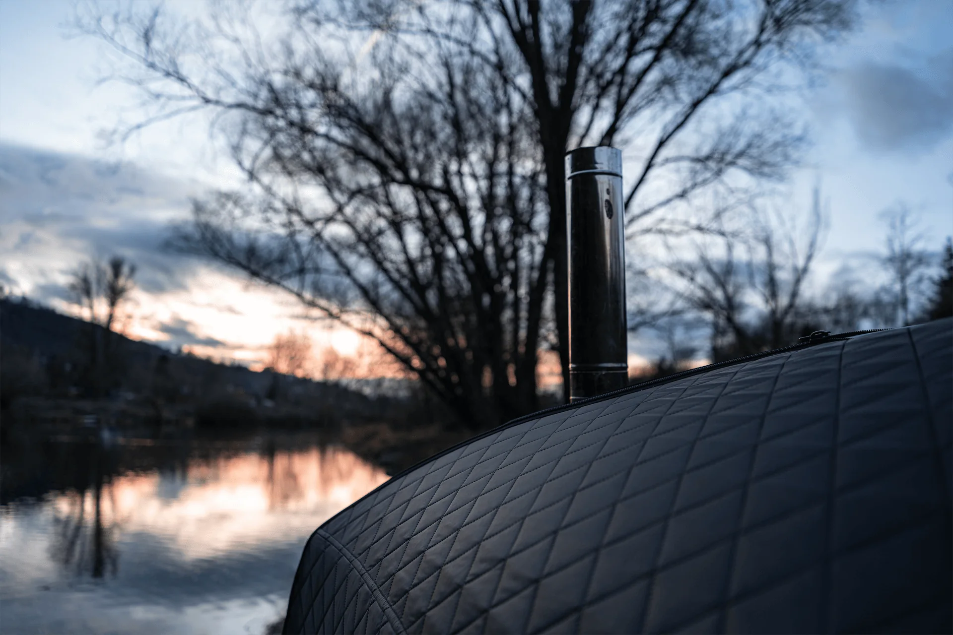 Close view of an insulated tent wall and stovepipe
